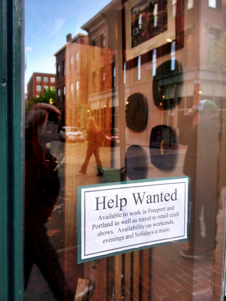 A help wanted sign on the door of Lovell Designs in Portland's Old Port hints of better unemployment numbers. Photographed on Friday, May 17, 2013.