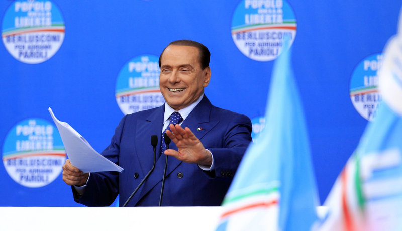 Silvio Berlusconi speaks May 11 in Brescia. In a separate trial from that of his three former aides, he is charged with paying for sex with a minor and trying to cover it up.