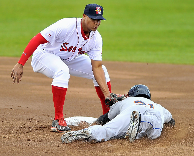 Portland shortstop Xander Bogaerts tags Binghamton’s Cesar Puello as he tries to steal second base during Friday’s game at Hadlock Field, won by the Mets.
