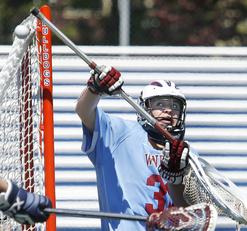 Windham goalie Frank Taylor makes a save during Saturday’s lacrosse game against Portland at Fitzpatrick Stadium. Portland won, 5-3.