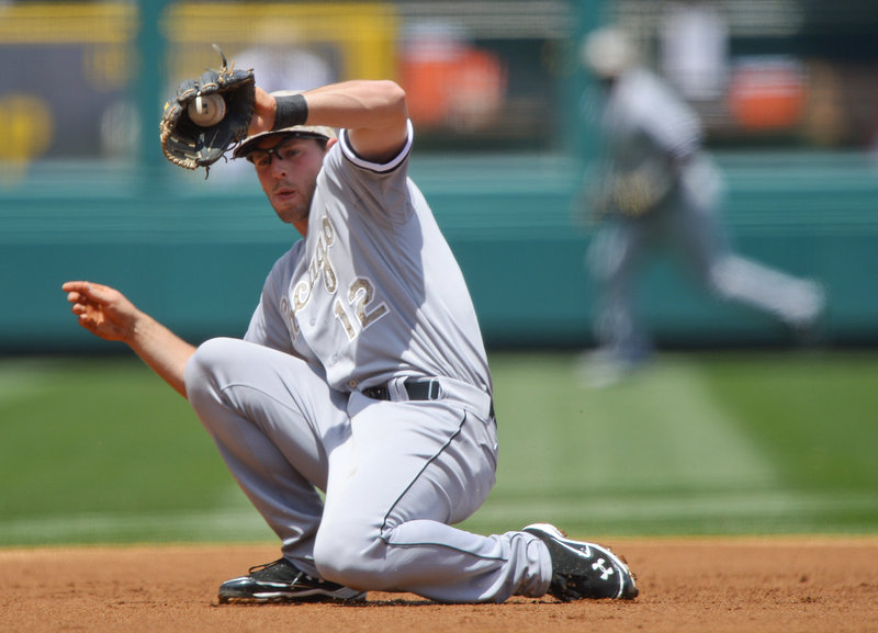 Chicago White Sox third baseman Conor Gillaspie snags a grounder hit by Albert Pujols to start a double play in a 12-9 loss to the Angels at Anaheim on Saturday.