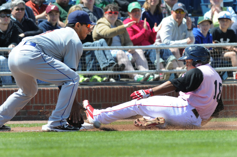 Portland’s Heiker Meneses slides safely into third base ahead of the throw to Binghamton infielder Josh Rodriguez during Saturday’s game at Hadlock Field, won by the Sea Dogs 10-7 in dramatic fashion.