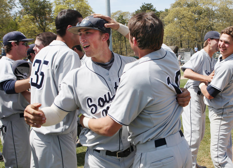 Nick Grady, left, and Troy Thibodeau are all smiles during Sunday’s celebration of their regional tournament victory.