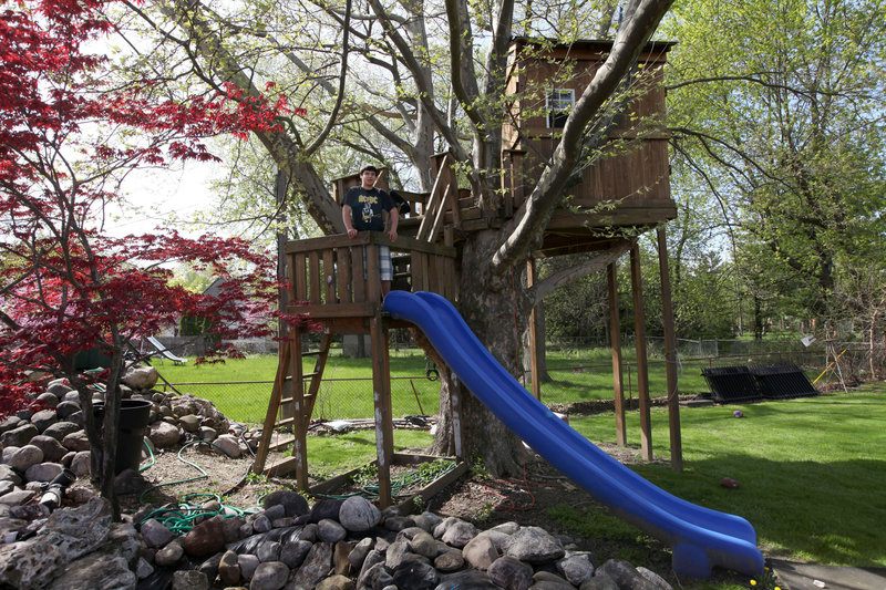 The Mifsud family’s backyard tree house has a bunk bed, a skylight and a slide.