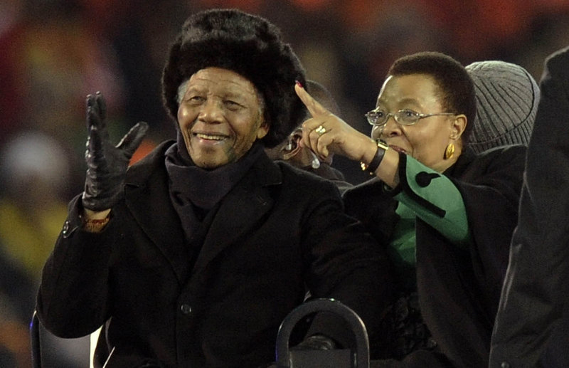 Former South African President Nelson Mandela and his wife, Graca Machel, attend the final of the FIFA World Cup Soccer Tournament in Johannesburg on July 11, 2010, his last public appearance. Mandela, now old and frail, lives in seclusion in his Johannesburg home, and the fighting over his image and legacy has already begun.