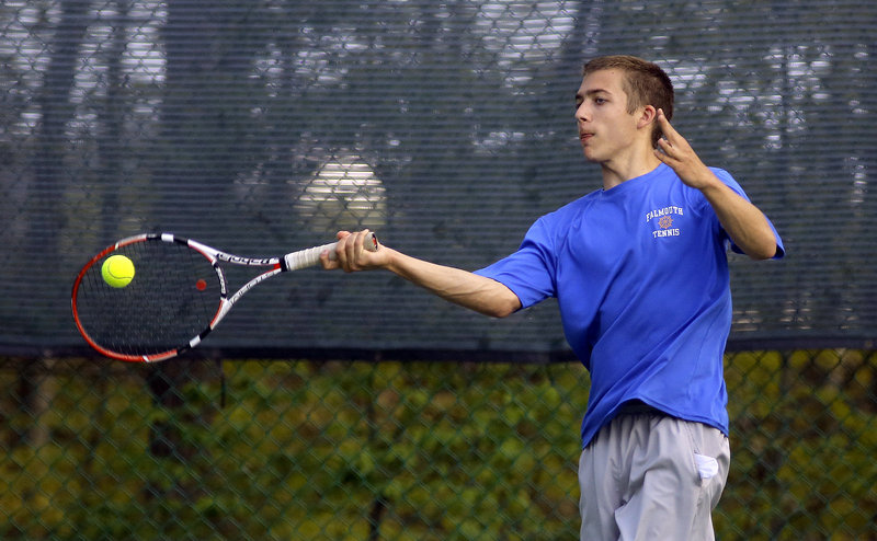 Sam Holland, Falmouth’s No. 3 singles player, hits a shot during his 6-3, 7-5 victory Monday against Waynflete’s Ben Shapiro, helping the visiting Yachtsmen to a 3-2 win.