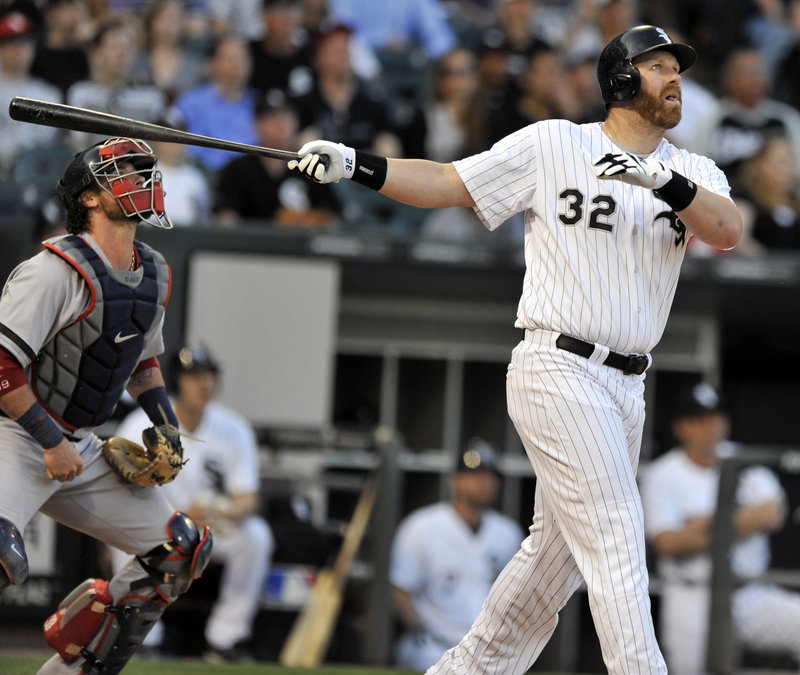 Adam Dunn of the White Sox and Red Sox catcher Jarrod Saltalamacchia watch Dunn’s three-run homer sail over the right-field fence in the first inning Tuesday night, starting Chicago on its way to a 6-4 win.