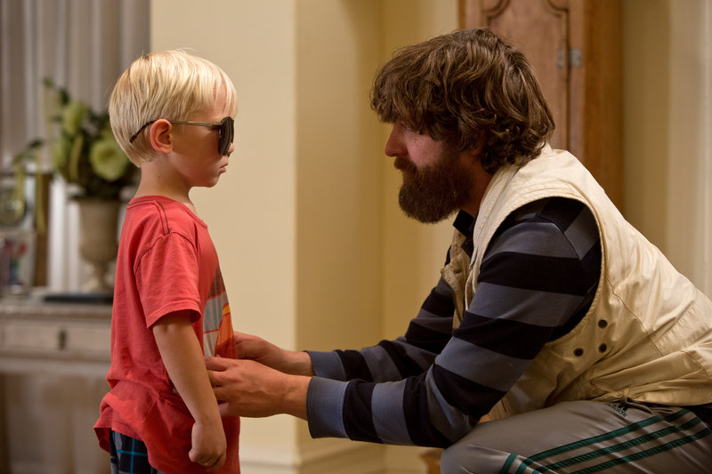 Grant Holmquist as Tyler/Carlos, left, and Zach Galifianakis as Alan appear in a scene from “The Hangover Part III.”