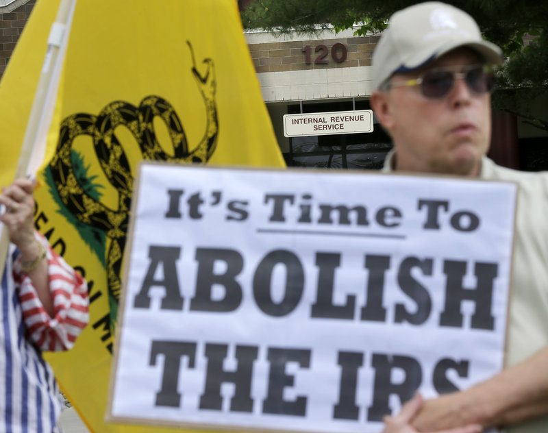 Cliff Toye joins others outside Internal Revenue Service offices in Cherry Hill, N.J., on Tuesday for a tea party rally protesting extra IRS scrutiny of conservative groups.