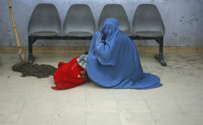 An Afghan woman awaits help in a clinic. Despite reforms to improve women’s rights, the rate of imprisonment of women and girls for “moral crimes” has increased 50 percent.