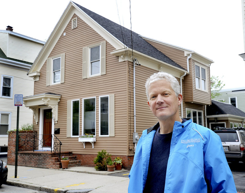 Matthew Kennedy stands in front of his newly purchased home on Beckett Street in Portland on Wednesday, May 22, 2013. Maine's residential real-estate market is heating up.