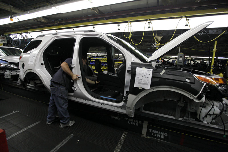 Workers on at many of Ford’s assembly plants, like this one in a 2010 file photo, will have less summer break this summer as car makers ramp up their capacity. Chrysler and General Motors also say they will take one week off at many plants instead of the usual two weeks off.