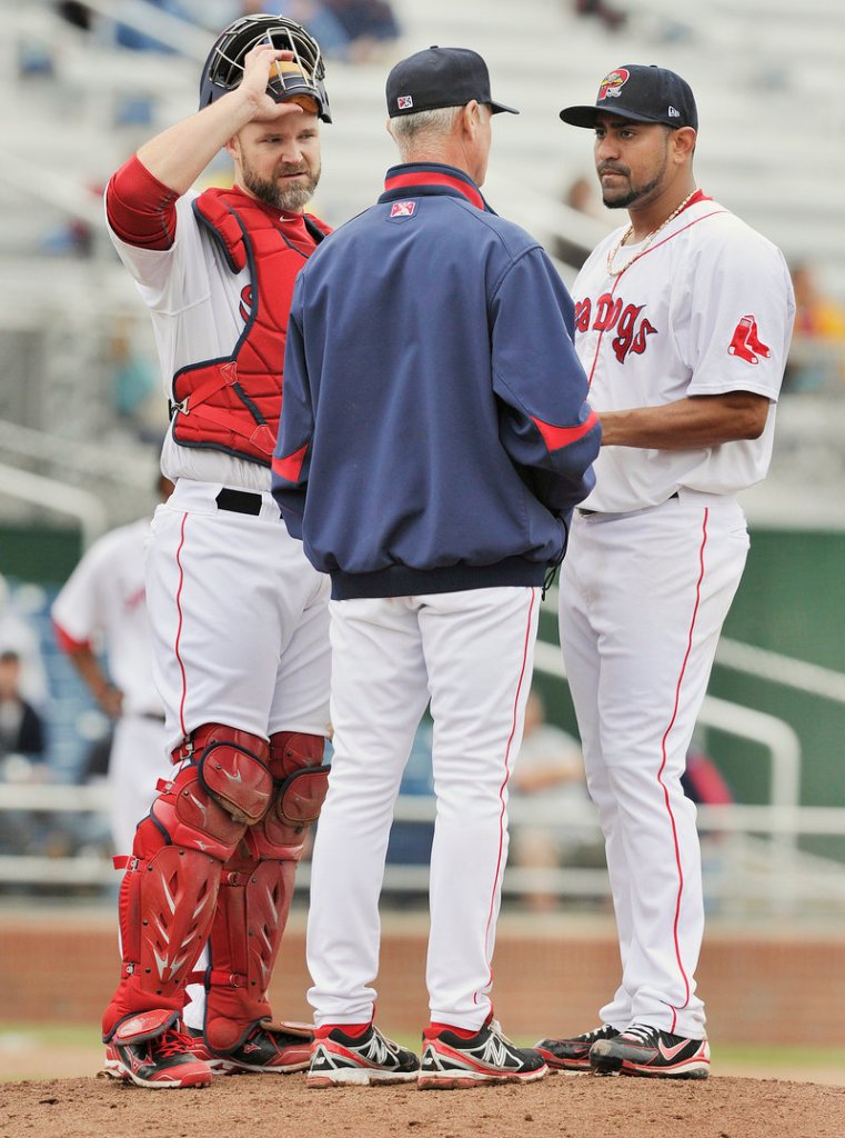 Franklin Morales and catcher David Ross, both in Portland on rehab assignments, listen to Sea Dogs pitching coach Bob Kipper in the fifth inning of an 8-4 victory Thursday at Hadlock Field.