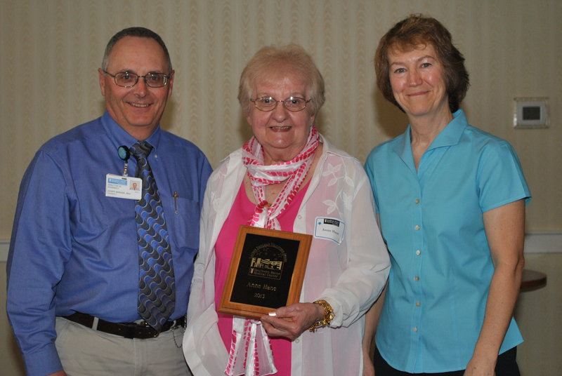 Southern Maine Medical Center’s pharmacy pirector Joe Bernier, left, and pharmacist Susan O’Connell, right, present Anne Hane the Lauren Shulman Volunteer of the Year award for 2013. Hane has been a volunteer at SMMC for eight years, spending more than 4,000 hours helping in the pharmacy.