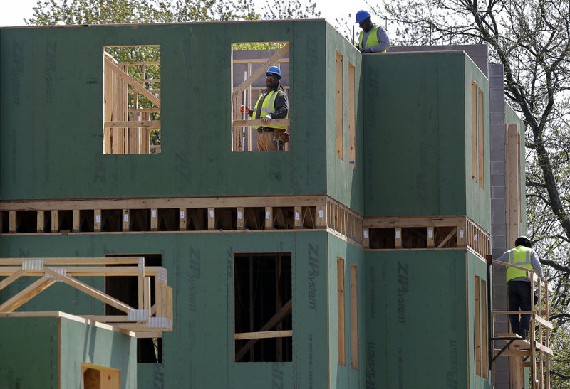 Workers are seen at the construction site of a new housing complex in Trenton, N.J., in April. U.S. sales of new homes rose in April, the Commerce Department reported Thursday.
