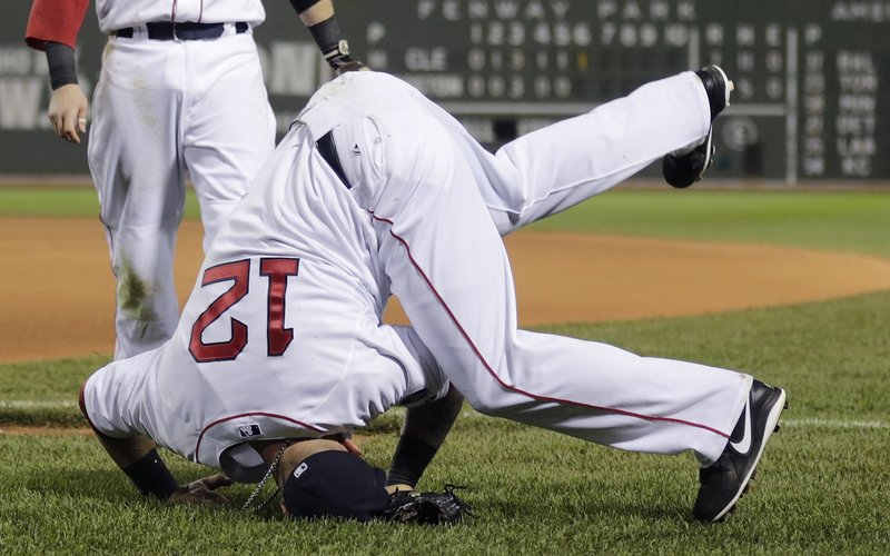 It was that kind of night for Boston as first baseman Mike Napoli lands on his head after missing a foul pop-up in the seventh inning of Thursday’s lopsided loss to Cleveland.