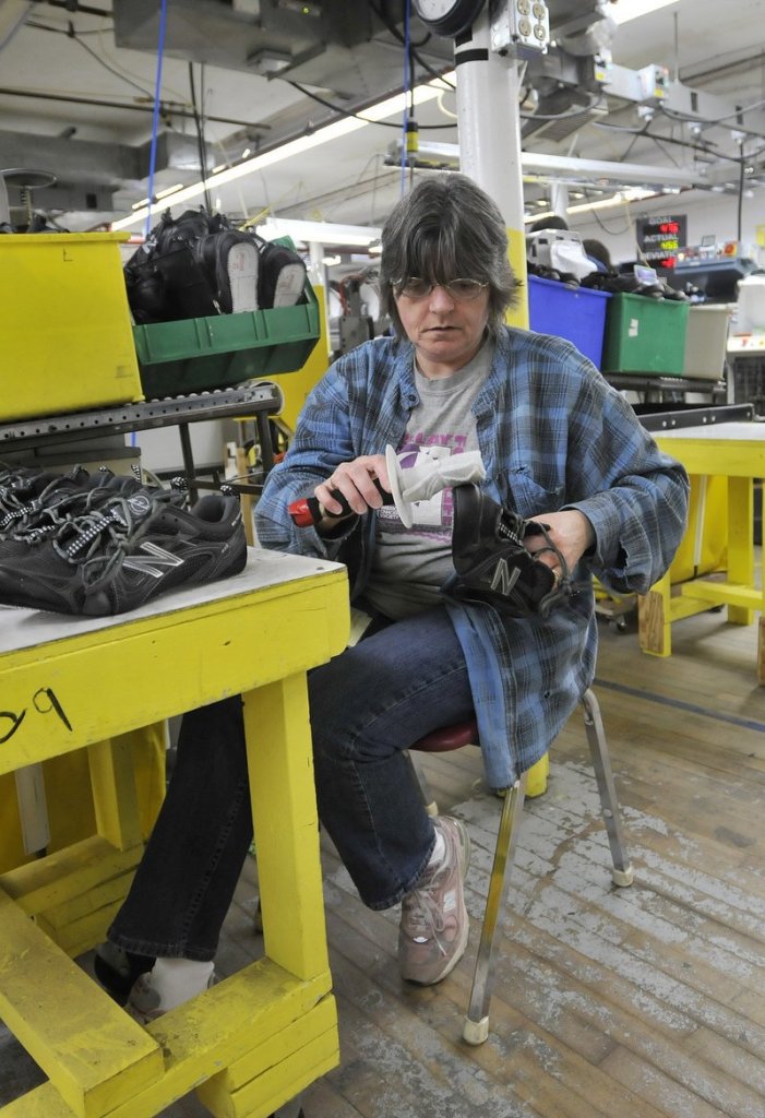 Debbie Foss washes shoes at the New Balance factory in Norridgewock. New Balance is one of the last remaining sneaker makers in the U.S.