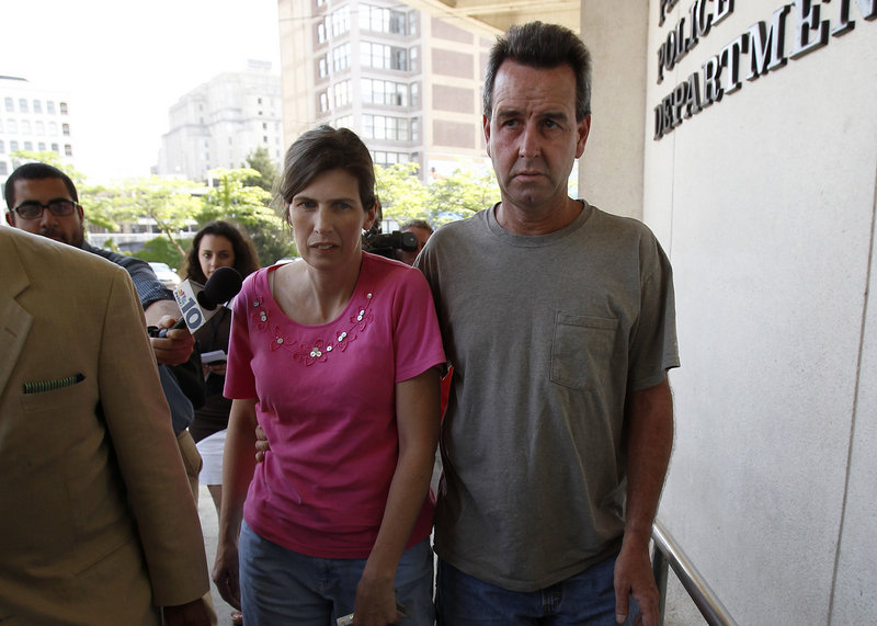 Catherine, left, and Herbert Schaible arrive at police headquarters in Philadelphia on Wednesday. The couple, who believe in faith healing over medicine, were charged with murder after a second young child died.