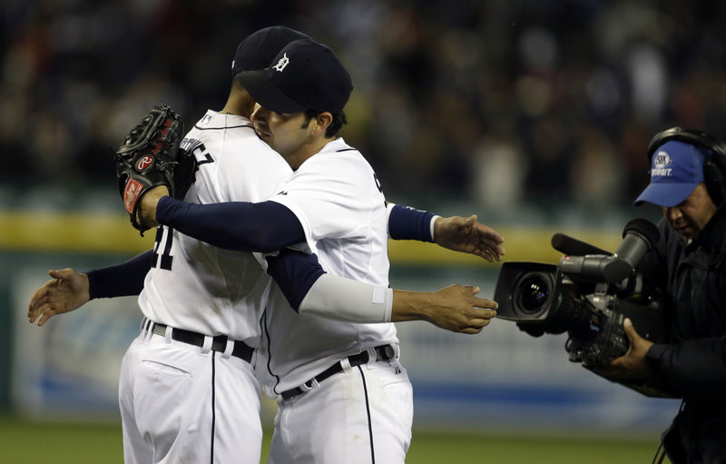 Detroit’s Anibal Sanchez, right, gets a congratulatory hug from teammate Victor Martinez after Sanchez nearly threw his second no-hitter of the season, ending up with a one-hit win on Friday.