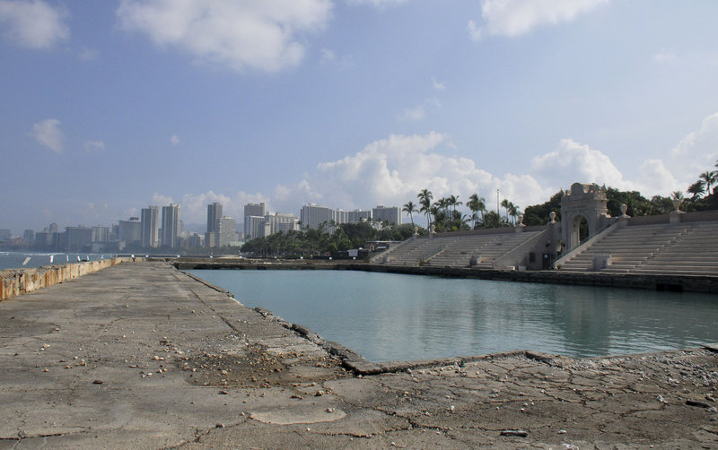 The Waikiki Natatorium in Honolulu, which includes a saltwater pool, was built in 1927 as a memorial to the 10,000 soldiers from Hawaii who served in World War I. The decaying structure has been closed to the public since 1979 amid debate over whether it should be demolished or restored to its former glory.