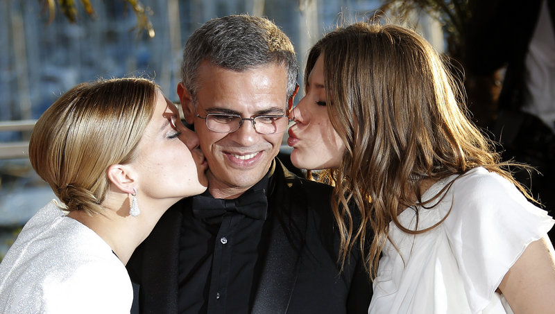 Actresses Lea Seydoux, left, and Adele Exarchopoulos flank director Abdellatif Kechiche in Cannes.