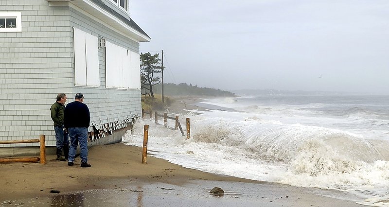 Waves crash at the end of Fairhaven Avenue in Camp Ellis last fall. Over the past four decades, the community has lost homes, roads and much of its beach to the ocean.
