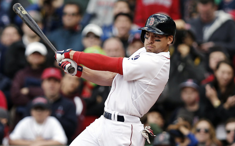 Jacoby Ellsbury follows through on his game-winning two-run double during the ninth inning of Boston’s 6-5 win over the Indians on Sunday.