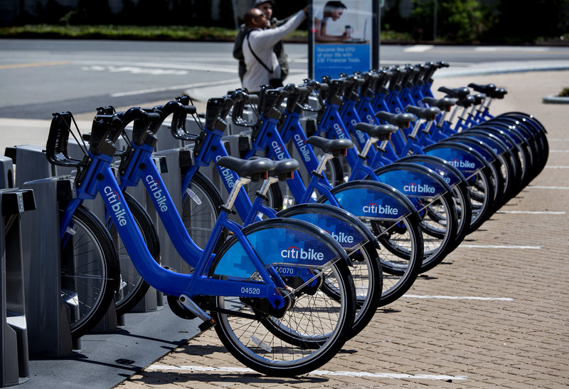 Bicycles are lined up at a dock and lock station at the Brooklyn Navy Yard as part of the bike share program.