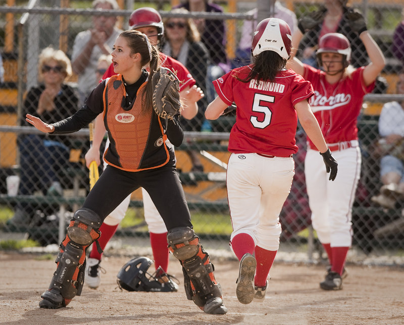 Biddeford catcher Katie Plante can only wait for a throw as Scarborough’s Mary Redmond scores during a six-run fourth inning Tuesday. Redmond had walked earlier in the inning.