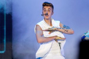 Canadian singer Justin Bieber performs on stage during a concert as part of his "Believe" World Tour in Dubai