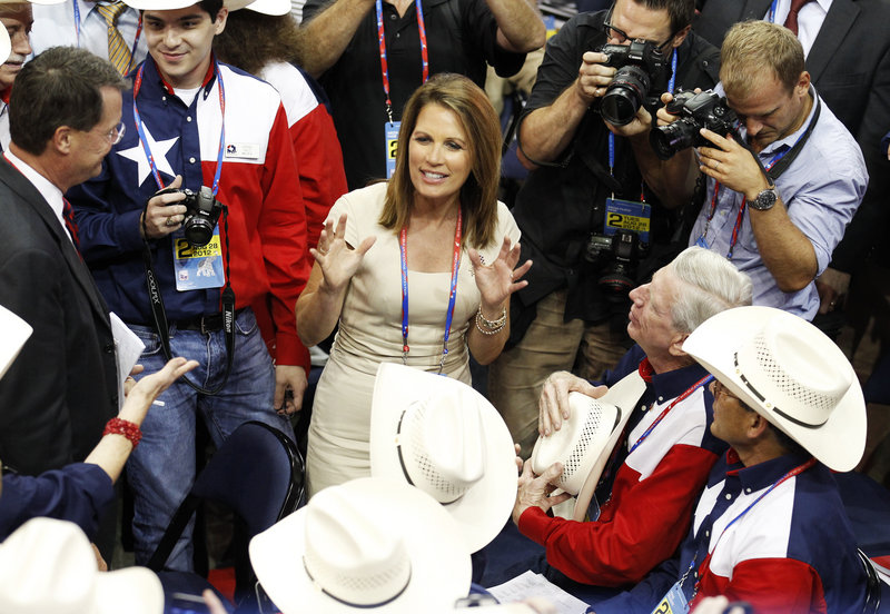 U.S. Rep. Michele Bachmann talks with members of the Texas delegation during the second session of the 2012 Republican National Convention in Tampa, Fla.