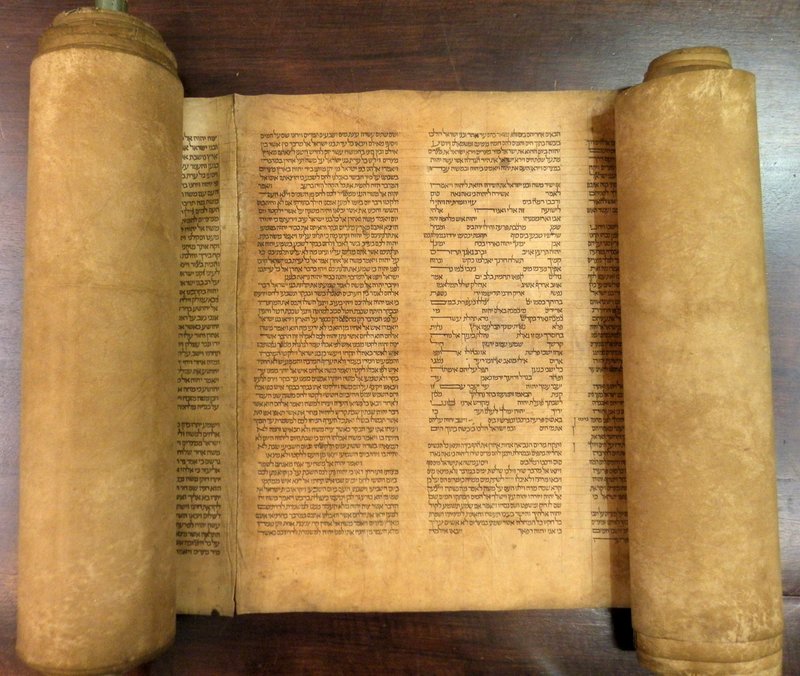 The scroll is shown in a photo from Alma mater Studiorum Universita’ di Bologna.