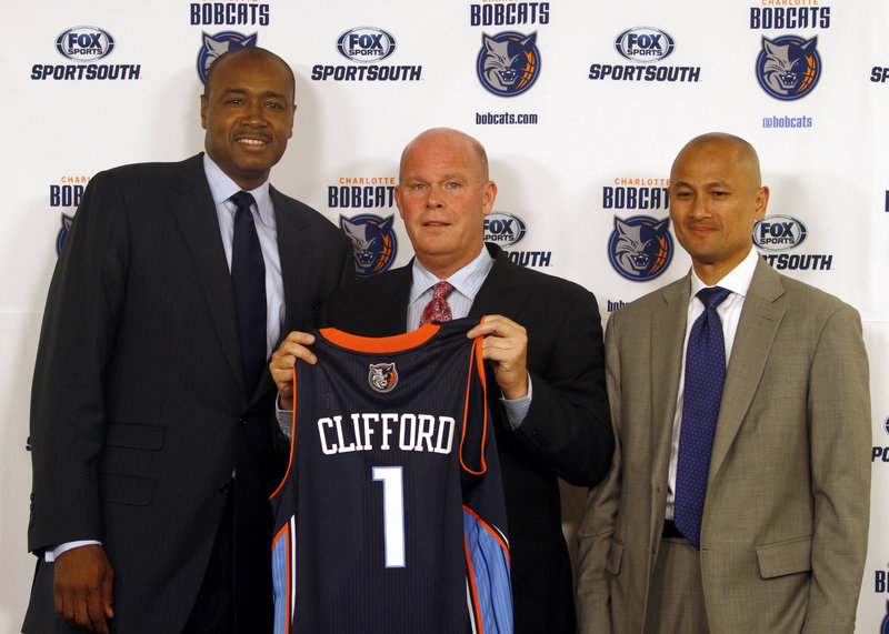 Steve Cliffford, who played at UMaine-Farmington and began his coaching career at Woodland High, is now the head coach of the Charlotte Bobcats, joining with Rod Higgins, left, the head of basketball operations, and General Manager Rich Cho.