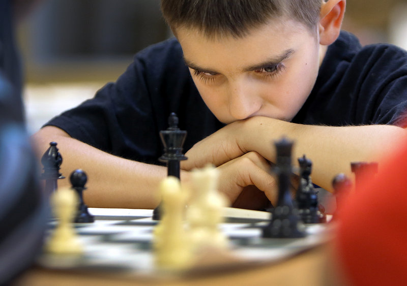 Mick Fennessy, 10, a fourth-grader at East End Community School in Portland, contemplates his next move while competing in the school's inaugural chess meet Wednesday, May 29, 2013.