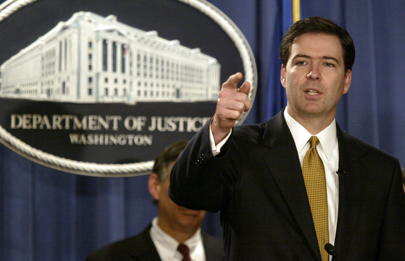 James Comey gestures during a June 2004 news conference in Washington. According to people familiar with the decision process, it looks likely that, in a bipartisan move, President Obama will nominate Comey to lead the FBI.