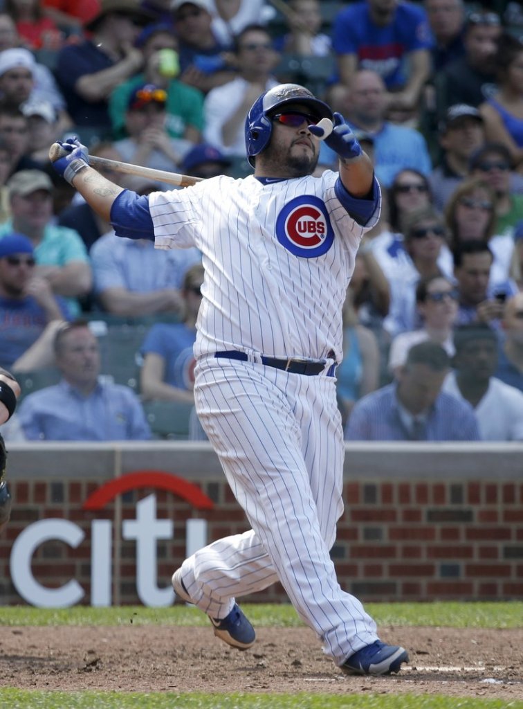 Dioner Navarro of the Cubs hits his third homer of the game Wednesday in leading his team over the White Sox, 9-3.