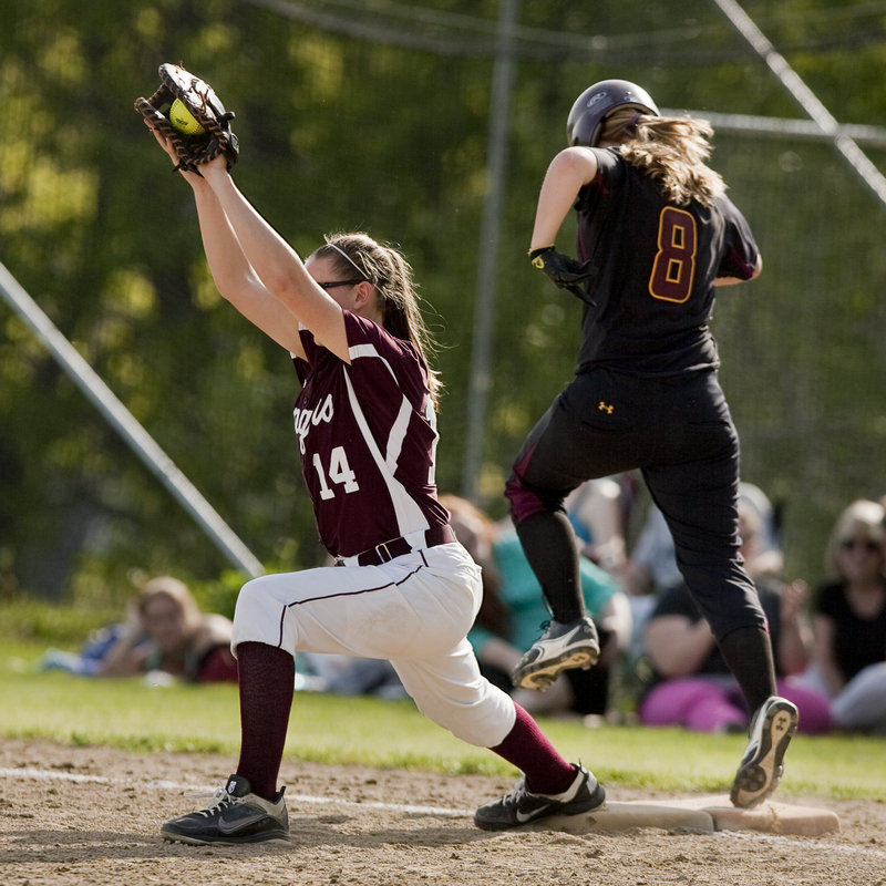 Mykaela Twitchell, the Greely first baseman, stretches to haul in a throw Thursday in time to retire Hannah Saturley of Cape Elizabeth during the Capers’ 5-0 victory in a game between two of the top teams in Class B.