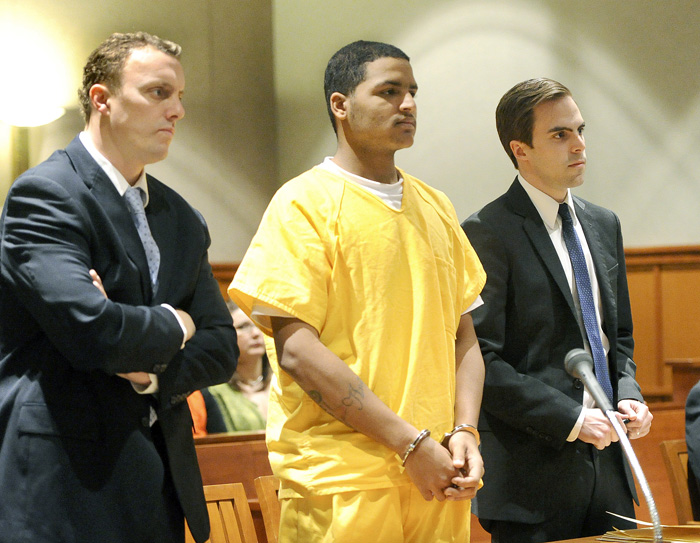 In this April 26, 2013 file photo, Anthony Pratt, 19, is flanked by his attorneys Peter Cyr and Dylan Boyd. Pratt is accused of killing Margarita Fisenko Scott last January in Portland.