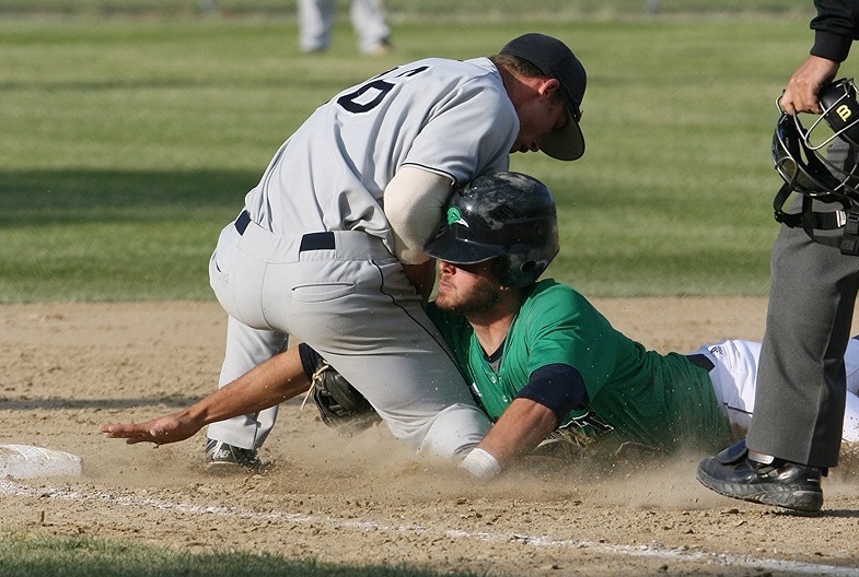 Nick Grady of the University of Southern Maine tags out Tad Gold of Endicott College as he slides into third base Saturday during the NCAA Division III New England baseball tournament in Harwich, Mass. USM and Endicott will play for the regional championship Sunday.