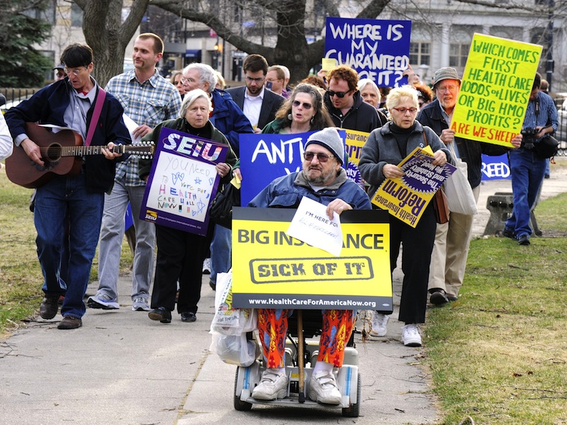 In this January 2011 file photo, demonstrators rally in Portland's Lincoln Park against efforts to overturn a state decision limiting health insurance rates. A pair of Democratic-backed adjustments to the Maine Republicans' 2011 health care reform law received initial approval in both houses of the Legislature, but will likely be vetoed by Gov. LePage.