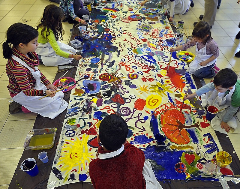 In this January 2013 file photo, students at Ocean Avenue Elementary School paint a Wall of Dreams mural to honor Martin Luther King, Jr. Facing overcrowding for a second year at Ocean Avenue Elementary School, the Portland School Board voted Tuesday, June 25, 2013 to carve out two neighborhoods on the edges of the school’s existing community and have new kindergartners there go to either East End or Hall elementary schools.