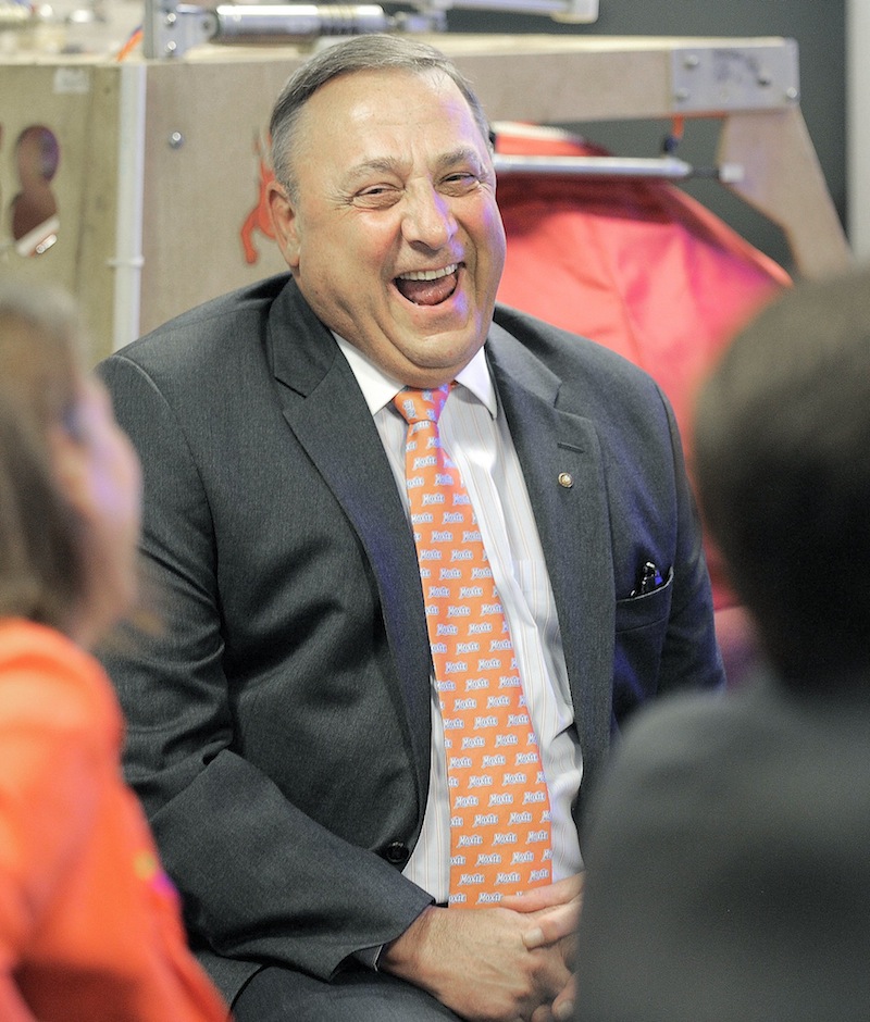 Gov. Paul LePage laughs at a joke made by Dean Kamen, inventor of the Segway PT, during an event at Fairchild Semiconductor in South Portland on Thursday.