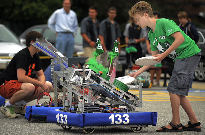 Aidan Qualey of Bonny Eagle loads flying discs into his team’s robot, named “Sherman,” outside Fairchild Semiconductor. Fairchild is contributing $100,000 to start the Robotics Institute of Maine, which hopes to have 1,000 students participating by 2016.