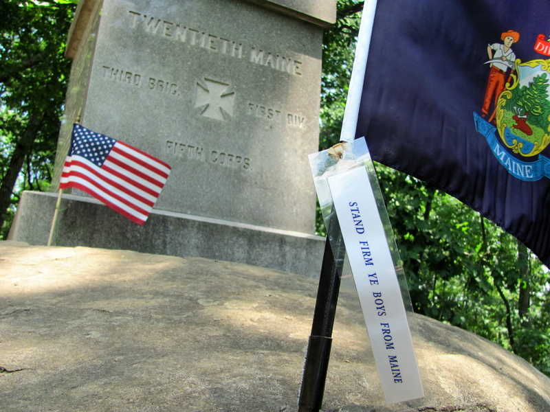A Maine flag is planted near the base of the monument to the 20th Maine Regiment, located on the slopes of Little Round Top where the Battle of Gettysburg was fought.