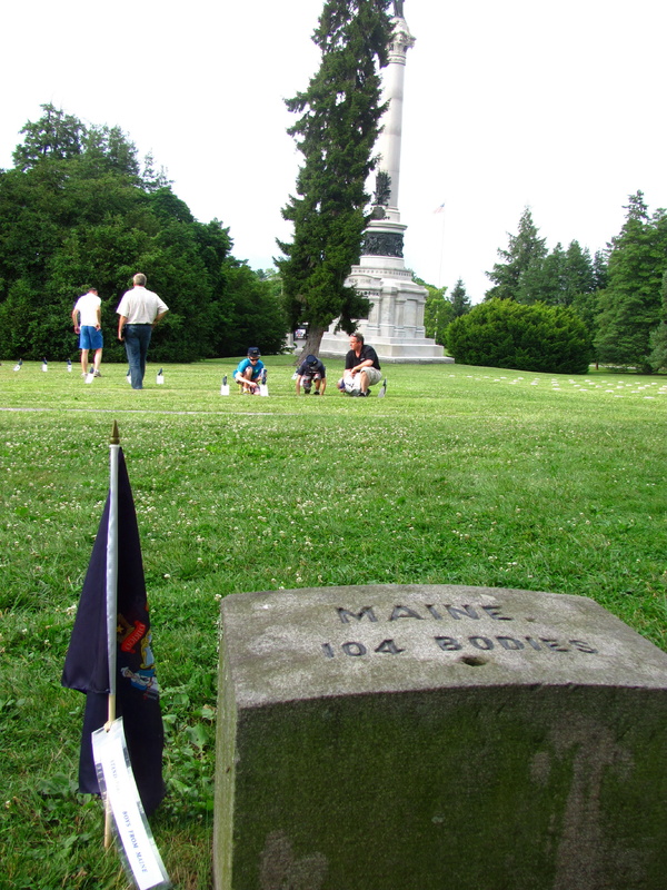 Soldiers’ National Cemetery holds the remains of 104 Maine soldiers who died during the Battle of Gettysburg in July 1863. In the background, Ken Quinn and his sons, Adrian and Sean, of Lisbon Falls pause to read placards placed at the graves of some of the Maine soldiers.