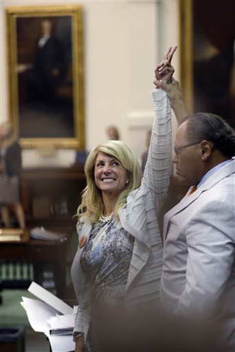 Sen. Wendy Davis, D-Fort Worth, who spent most of the day Tuesday staging an old-fashioned filibuster of the abortion bill, reacts as time expires. Her Twitter following went from 1,200 in the morning to more than 20,000 by Tuesday night.