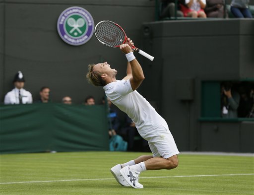Steve Darcis of Belgium reacts as he defeats Rafael Nadal of Spain in their men's first round singles at Wimbledon Monday.