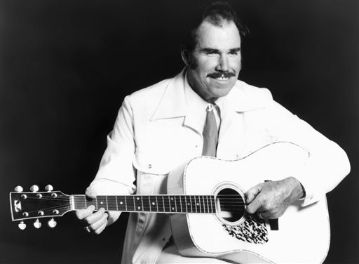 This undated photo shows country singer Slim Whitman. His career began in the late 1940s, and his tenor falsetto and ebony mustache and sideburns became global trademarks.