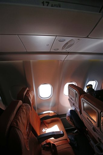 Light shines through a cabin window on seat 17A, the empty seat that an Aeroflot official said was booked in the name of former CIA technician Edward Snowden, on flight SU150 from Moscow to Havana, Cuba, Monday.