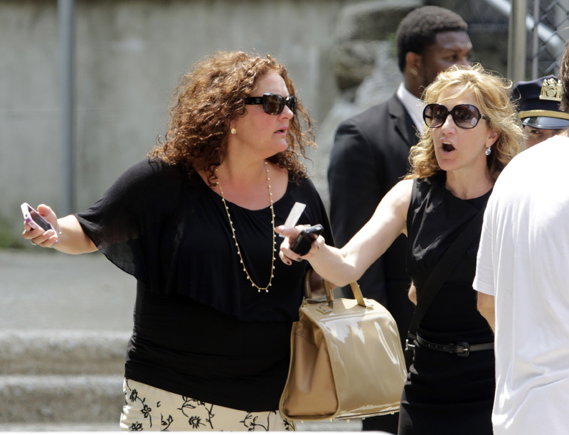 Actresses Aida Turturro, left, and Edie Falco leave the funeral service of James Gandolfini, star of "The Sopranos," at the Cathedral Church of Saint John the Divine in New York on Thursday.